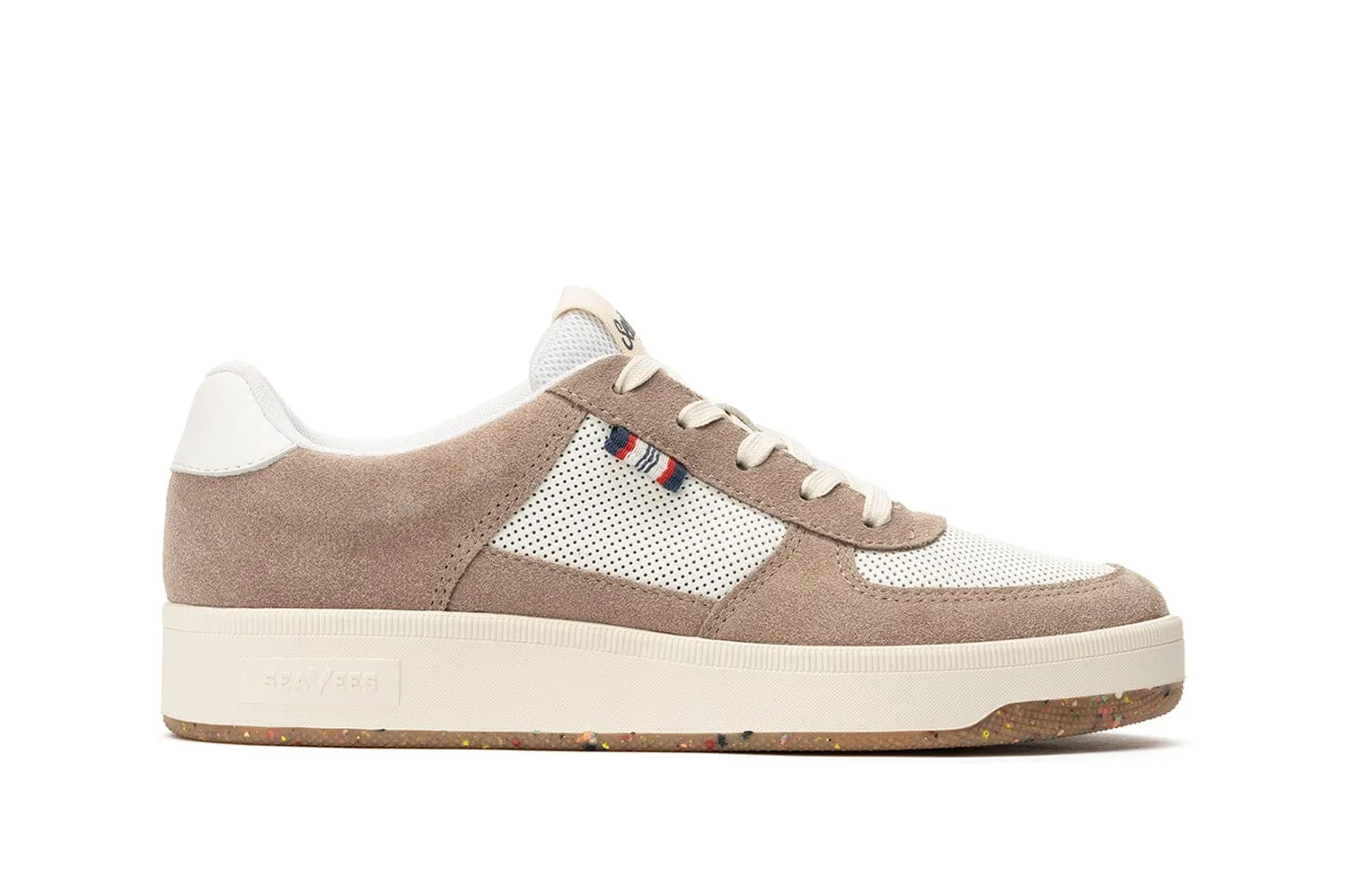 Beige and white suede sneaker with perforated panels and speckled rubber sole